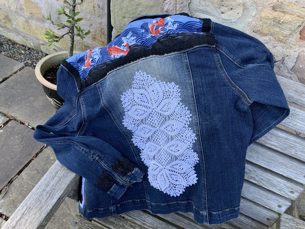Denim jacket with fish embellishments