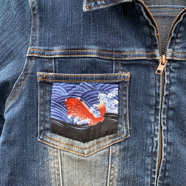 Denim jacket with fish embellishments