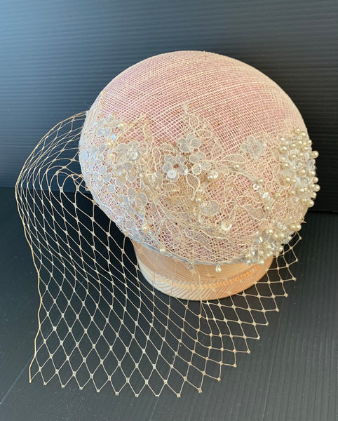 Jeannie - Blush pink small button fascinator with ivory pearl embellished lace and tiny cafe au lait colour veil
