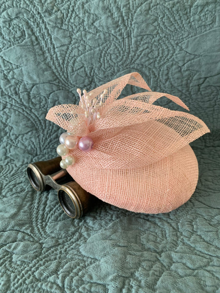 Nora - pale pink button fascinator  with crisp petal and multi colour pearl trim