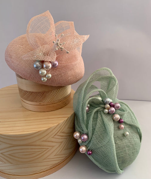 Shona - pale green small button fascinator with sinamay swirls and pearl embellishment